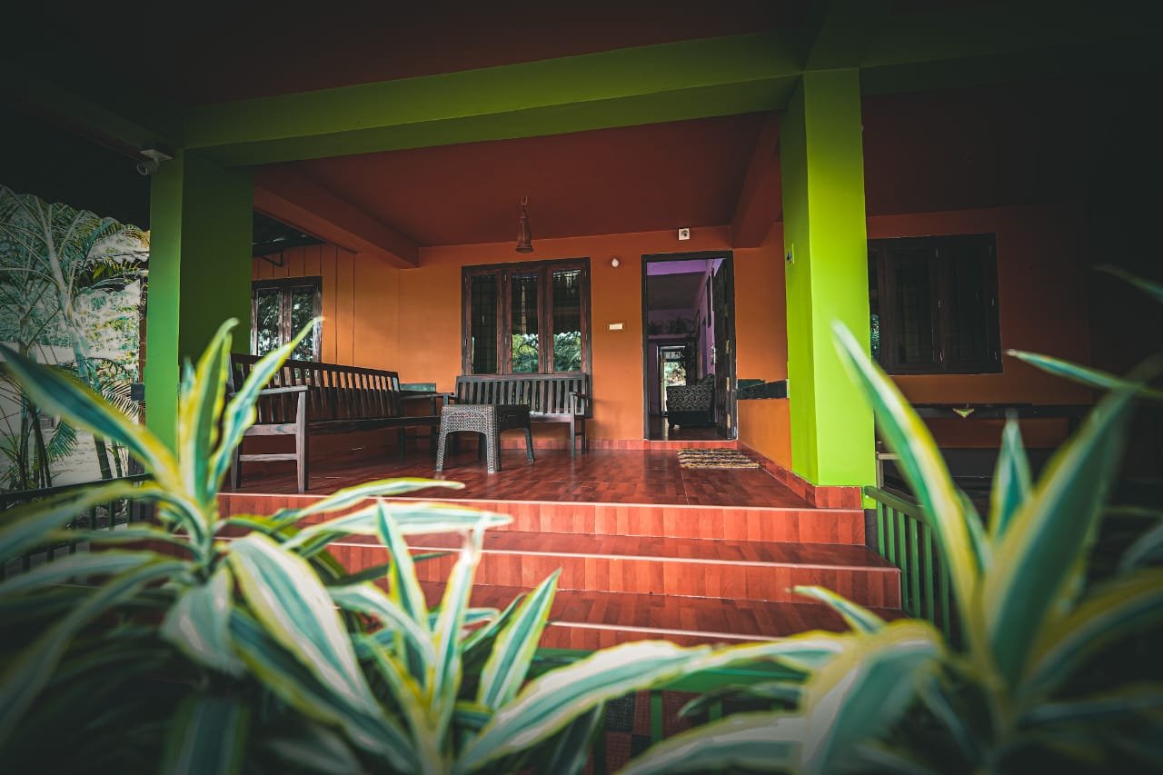 Traditional Kerala-style veranda with red-oxide steps